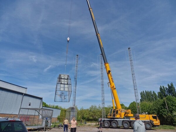 image by Vandamme Guillaume  containing crane, person, stand, man, construction site
