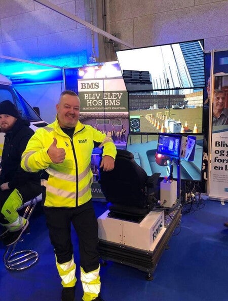 image by Casper Ørum containing man, stand, police, yellow, ambulance