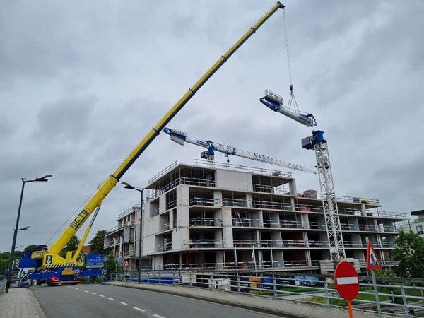 image by Renaud Devriese containing crane, building, build, lift, construction site